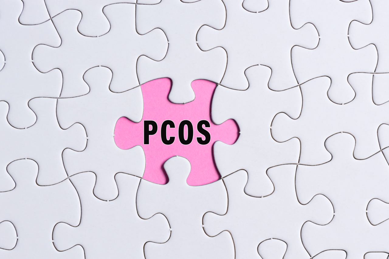 Illustration of puzzle pieces where one piece is labeled PCOS